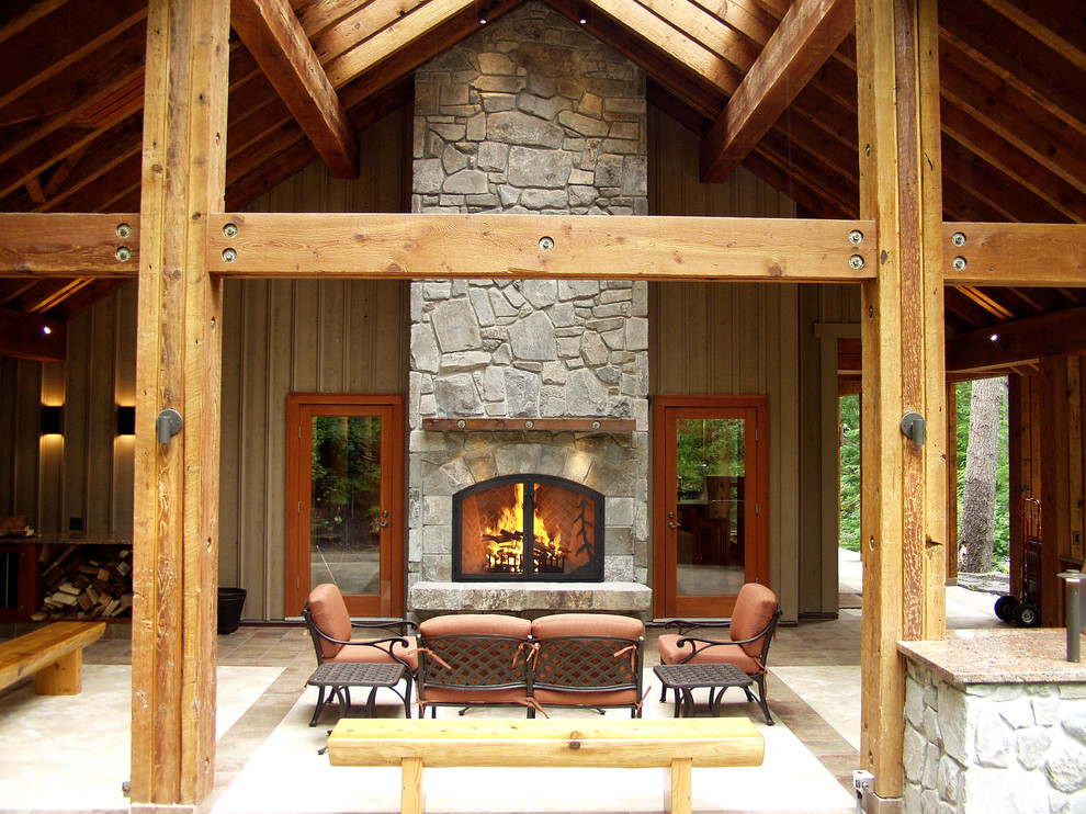 Design ideas for a traditional verandah in Vancouver with a fire feature.