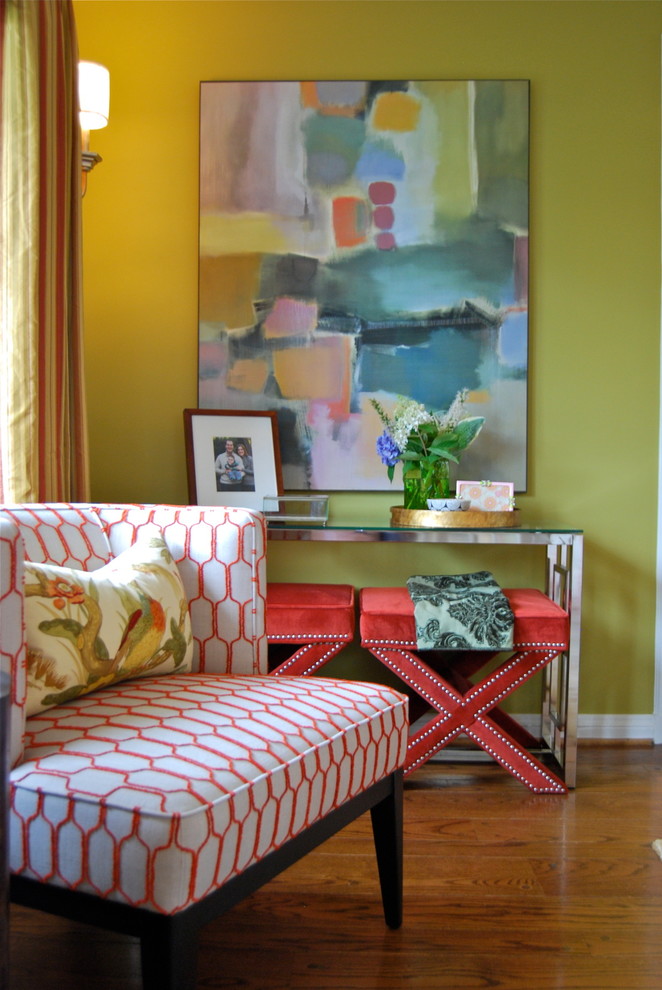 Mid-sized traditional enclosed family room in New York with yellow walls, dark hardwood floors, no fireplace, no tv and brown floor.