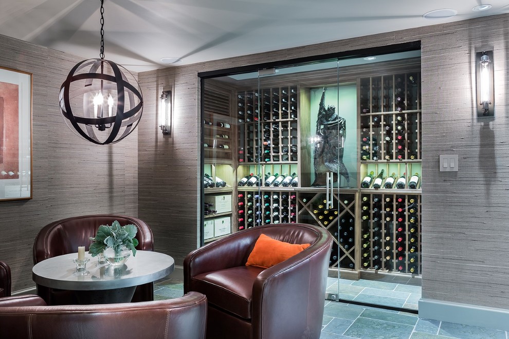 Wine cellar - mid-sized transitional blue floor wine cellar idea in Boston with storage racks