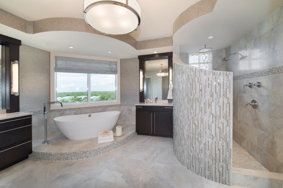 Inspiration for a mid-sized modern master bathroom with flat-panel cabinets, dark wood cabinets, a freestanding tub, an open shower, a one-piece toilet, marble floors, an undermount sink, marble benchtops, an open shower, a double vanity, a freestanding vanity, recessed and wallpaper.