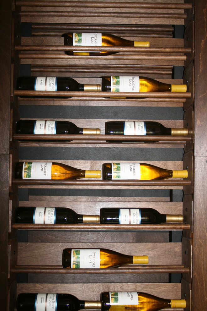 Inspiration for a transitional wine cellar in Santa Barbara with storage racks.