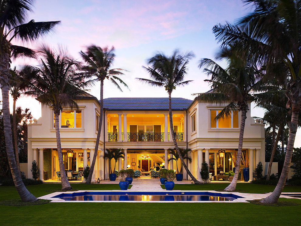 Design ideas for a tropical two-storey exterior in Miami.