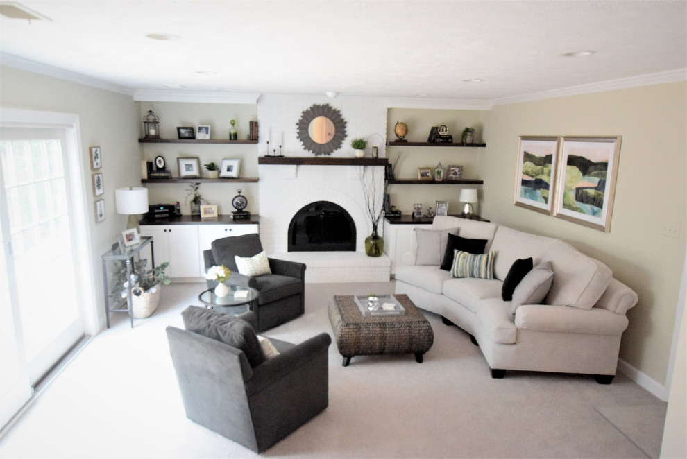 This is an example of a mid-sized country open concept family room in DC Metro with green walls, carpet, a standard fireplace, a brick fireplace surround, a corner tv and grey floor.