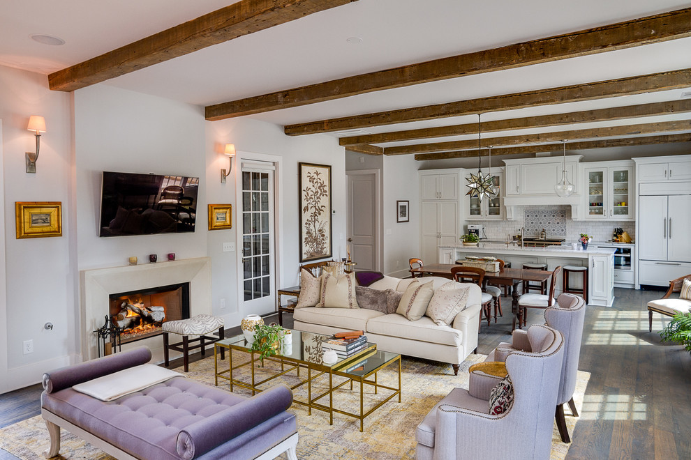 Mid-sized traditional open concept family room in Atlanta with white walls, dark hardwood floors, a standard fireplace, a wall-mounted tv and brown floor.