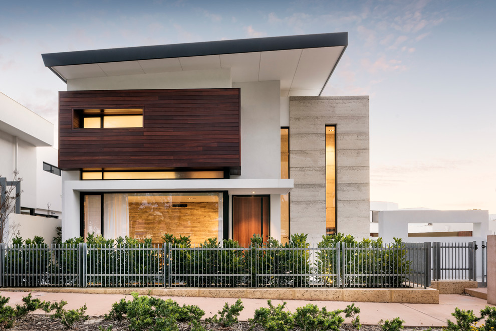 This is an example of a small contemporary three-storey white exterior in Perth with wood siding and a flat roof.
