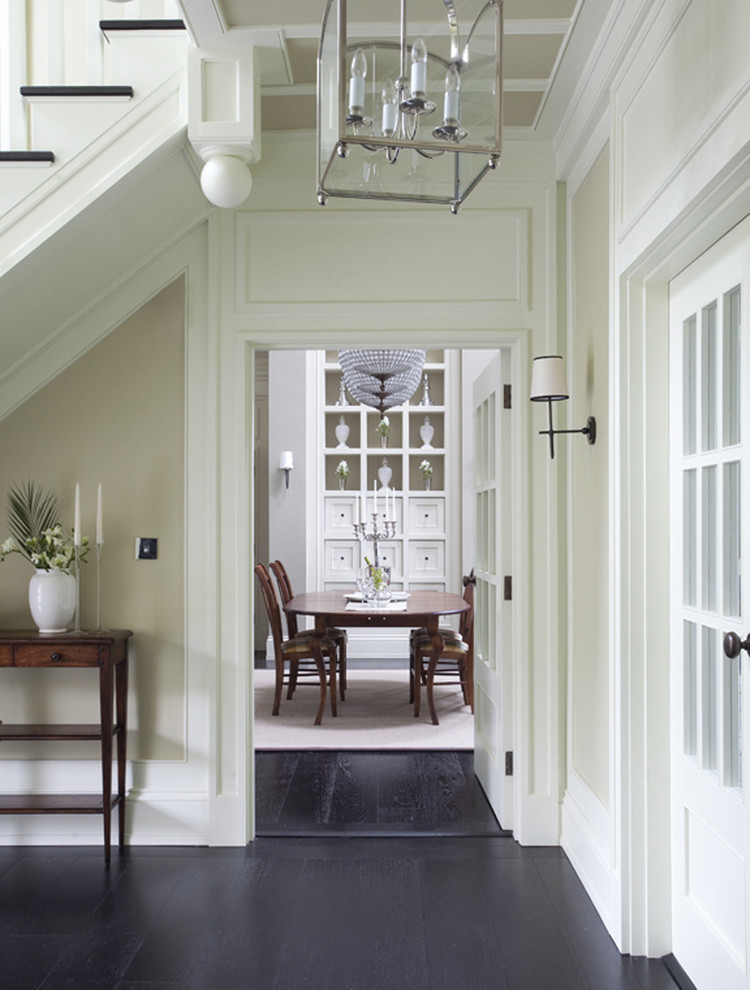 Inspiration for a traditional hallway in Dublin with beige walls and black floor.