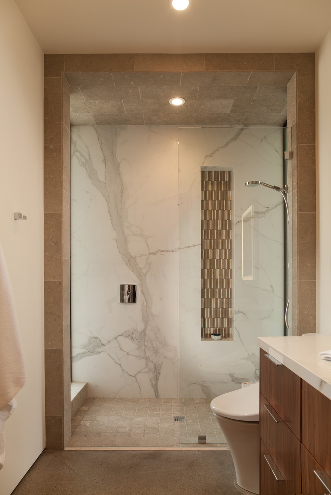 Mid-sized modern master bathroom in Orange County with flat-panel cabinets, medium wood cabinets, an alcove shower, a one-piece toilet, white walls, concrete floors, an undermount sink, engineered quartz benchtops, grey floor and a sliding shower screen.