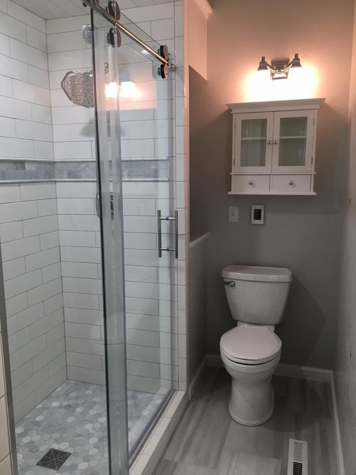 Example of a mid-sized transitional 3/4 white tile and subway tile dark wood floor and gray floor alcove shower design with a two-piece toilet and gray walls