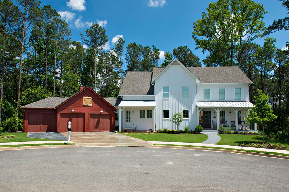 Design ideas for a mid-sized country two-storey white exterior in Atlanta with a hip roof and mixed siding.