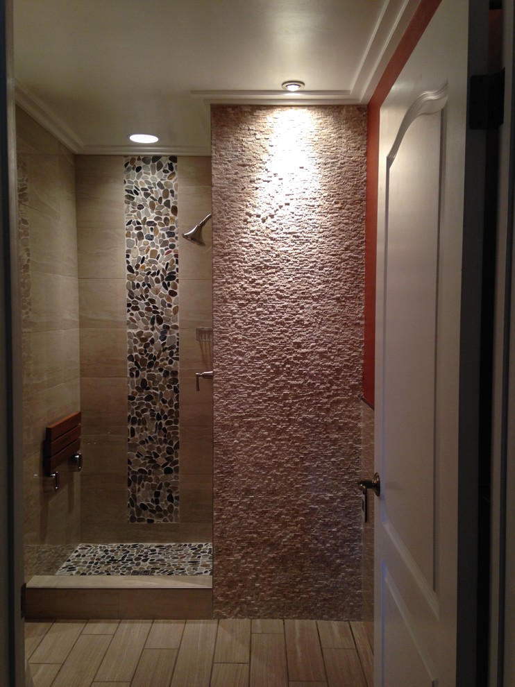 Design ideas for a mid-sized asian bathroom in Los Angeles with an alcove shower, beige tile, porcelain tile, red walls and porcelain floors.