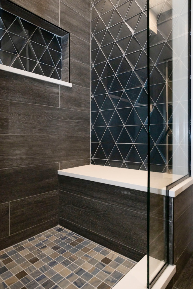 Design ideas for a mid-sized modern master bathroom in Chicago with blue cabinets, gray tile, wood-look tile, grey walls, a double vanity, shaker cabinets, an alcove shower, a two-piece toilet, mosaic tile floors, an undermount sink, multi-coloured floor, a shower seat and a built-in vanity.