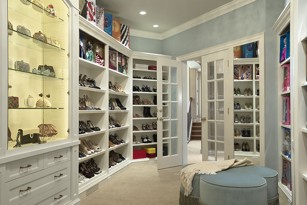 Design ideas for a contemporary women's dressing room in Minneapolis with open cabinets, white cabinets and carpet.