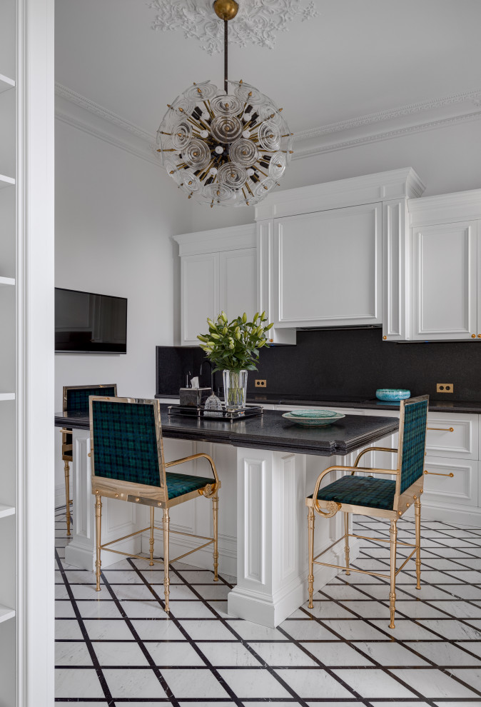 Photo of a large traditional l-shaped separate kitchen in Other with a double-bowl sink, raised-panel cabinets, white cabinets, marble benchtops, black splashback, marble splashback, black appliances, marble floors, with island, white floor, black benchtop and coffered.