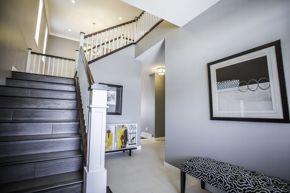 Mid-sized trendy vinyl floor foyer photo with gray walls