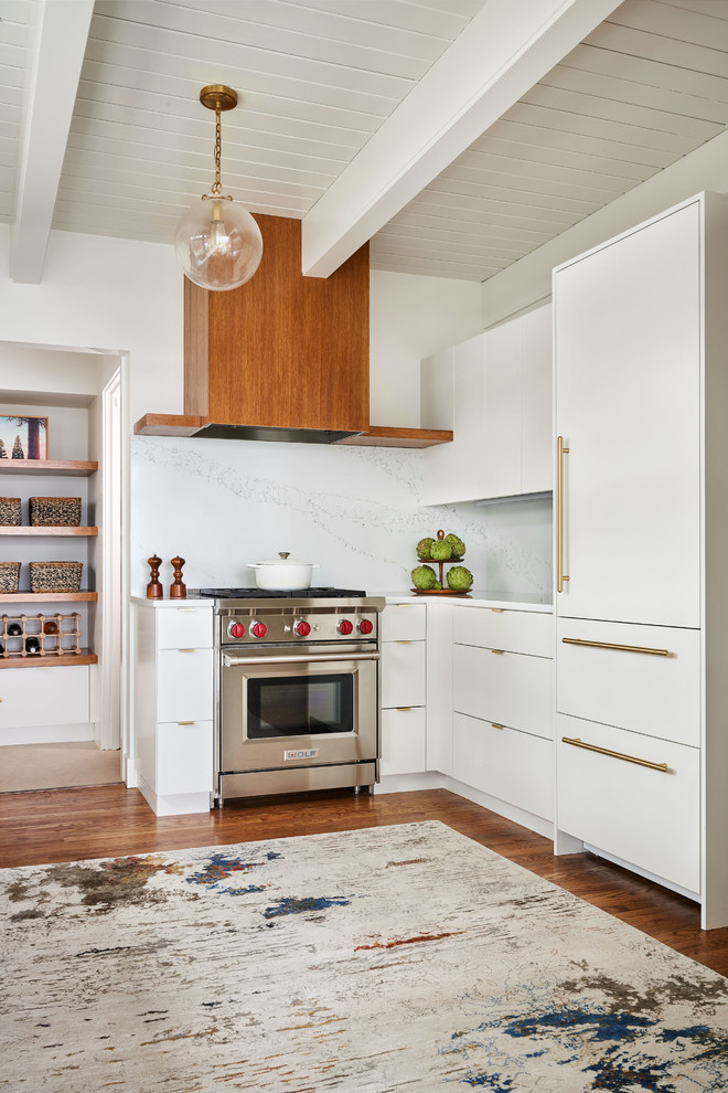 Example of a large trendy u-shaped medium tone wood floor and brown floor kitchen pantry design in Portland with an undermount sink, flat-panel cabinets, white cabinets, quartz countertops, white backsplash, stone slab backsplash, paneled appliances, no island and white countertops