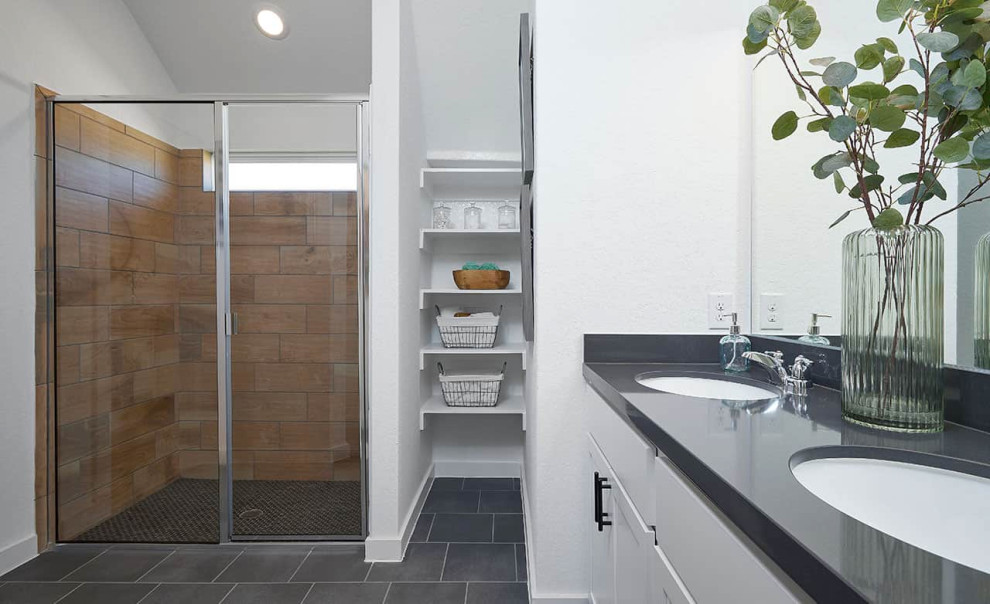 Inspiration for a contemporary ensuite bathroom in Other with recessed-panel cabinets, white cabinets, a two-piece toilet, white tiles, ceramic tiles, white walls, laminate floors, a submerged sink, brown floors, a single sink, a built in vanity unit, a built-in shower, a hinged door and grey worktops.