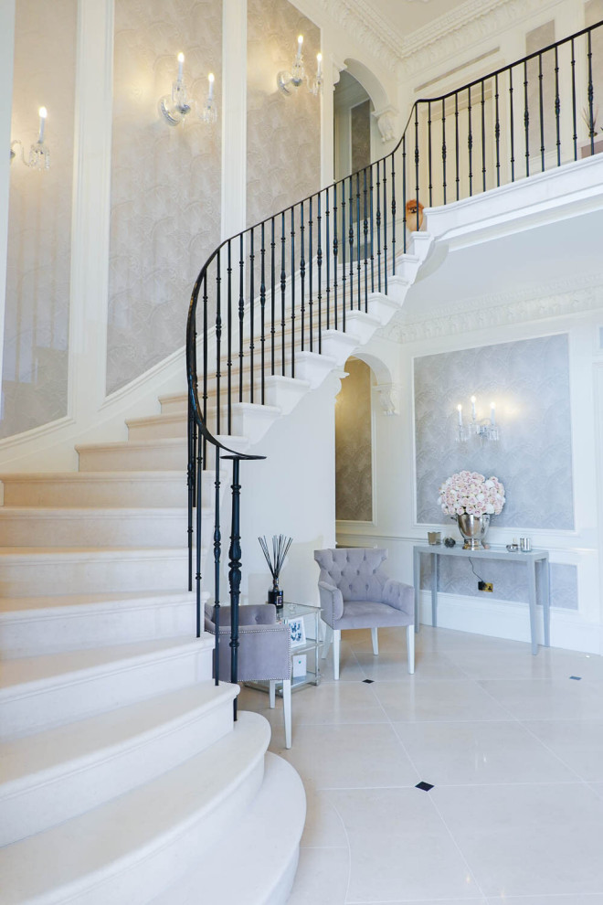 Photo of a traditional limestone curved staircase in Other with limestone risers and wood railing.