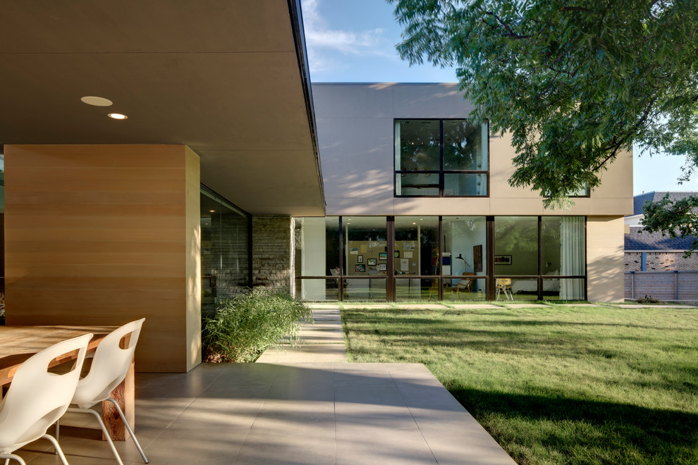 Photo of a contemporary exterior in Dallas with wood siding.