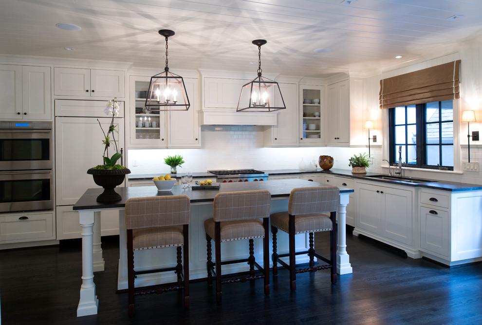 Kitchen - mid-sized transitional l-shaped dark wood floor kitchen idea in Atlanta with a double-bowl sink, recessed-panel cabinets, white cabinets and paneled appliances