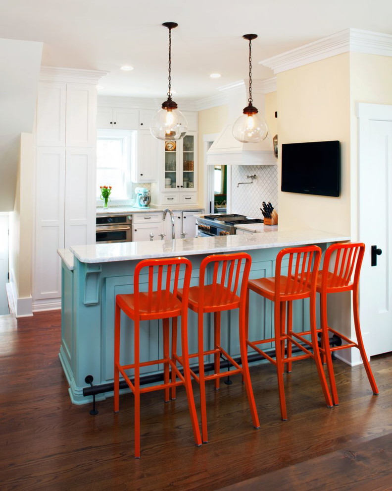 Elegant eat-in kitchen photo in Omaha with a farmhouse sink, white cabinets, granite countertops, stainless steel appliances and white backsplash