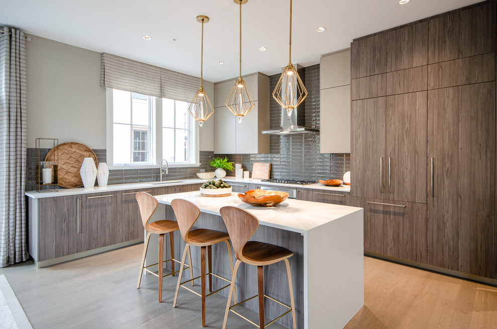 Inspiration for a contemporary l-shaped kitchen in DC Metro with an undermount sink, flat-panel cabinets, brown cabinets, grey splashback, medium hardwood floors, with island, brown floor and white benchtop.
