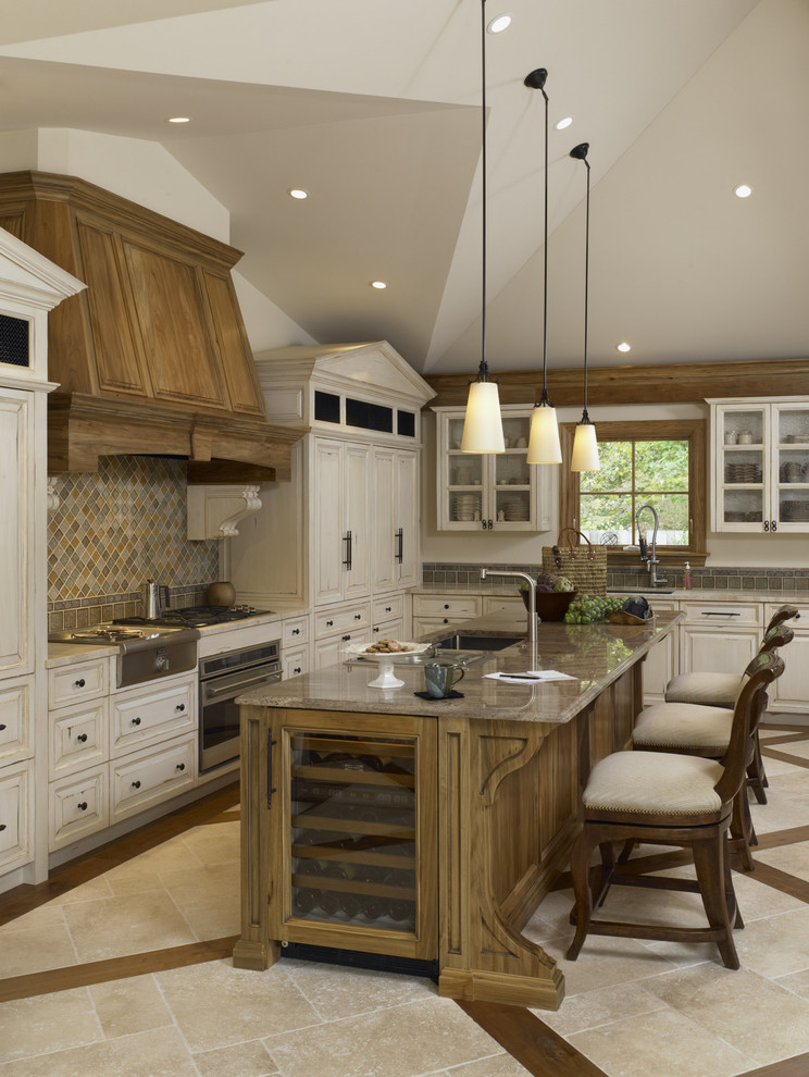 Design ideas for a traditional kitchen in Chicago with glass-front cabinets and panelled appliances.