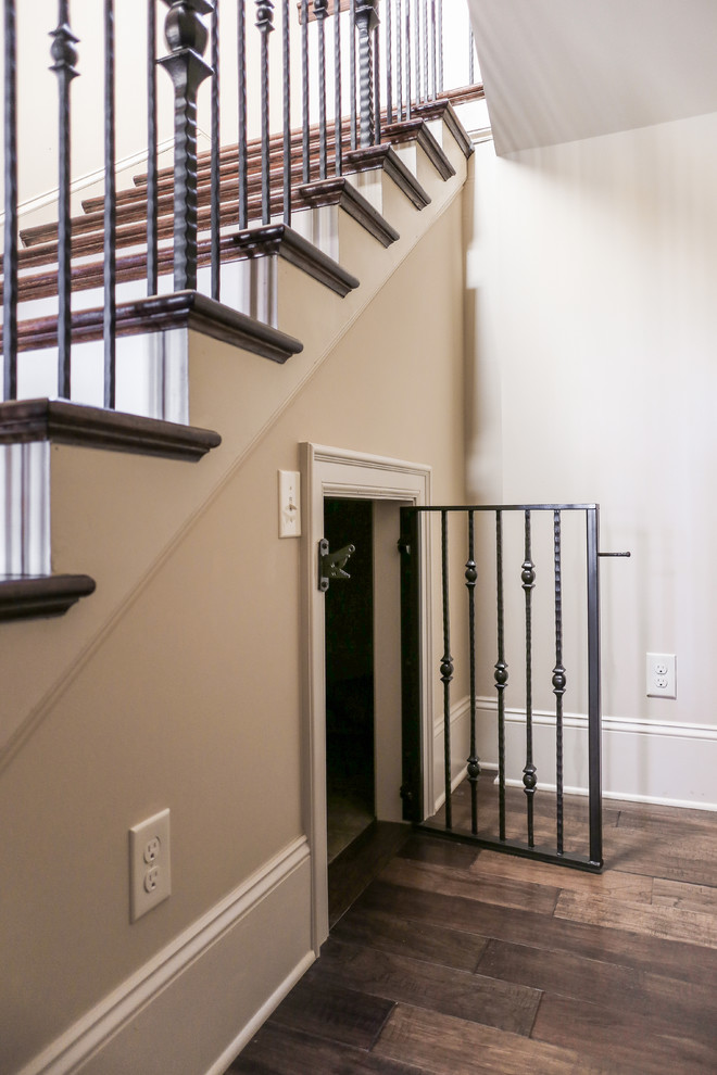 This is an example of a large country wood staircase in Charlotte with painted wood risers.