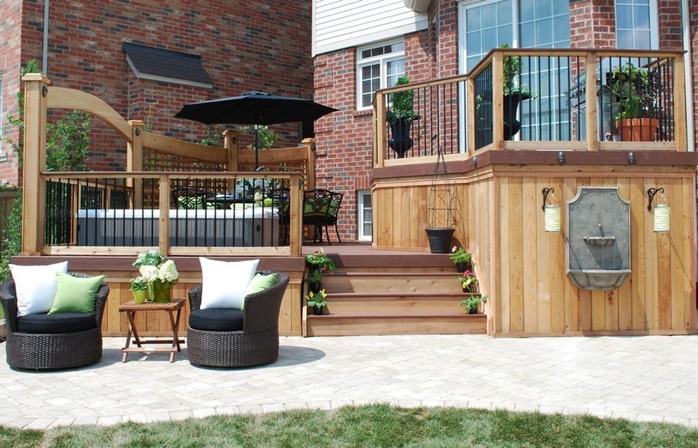 Photo of a traditional deck in Toronto with a water feature.