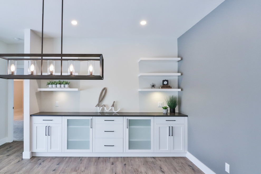 Inspiration for a mid-sized transitional vinyl floor and brown floor kitchen/dining room combo remodel with gray walls