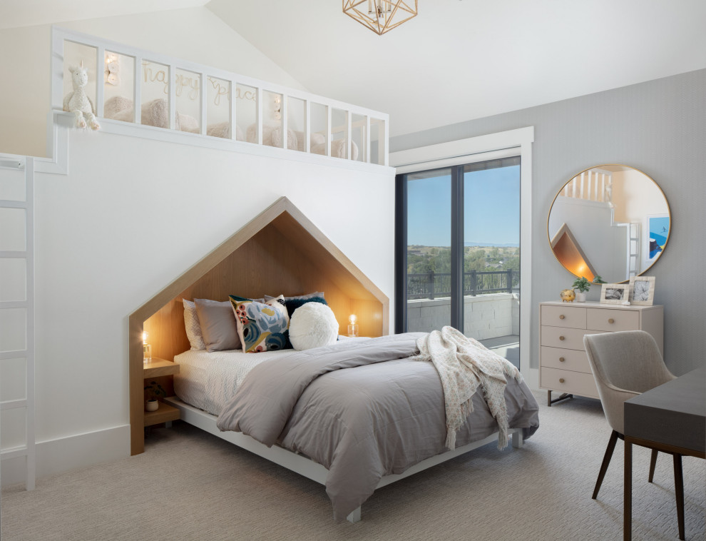 Girl Kid's Bedroom with Built-In Secret Room and Loft - This kids' bedroom is uniquely designed with a built-in bed niche with a house-like cutout, and a loft overhead provides space for playing or storing toys. Inside the loft is a secret room for imaginative play. The dusty blue walls are complimented by gold accents and teal bedding.