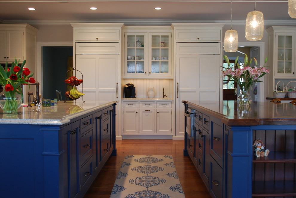 Design ideas for a traditional kitchen in New York with multiple islands.
