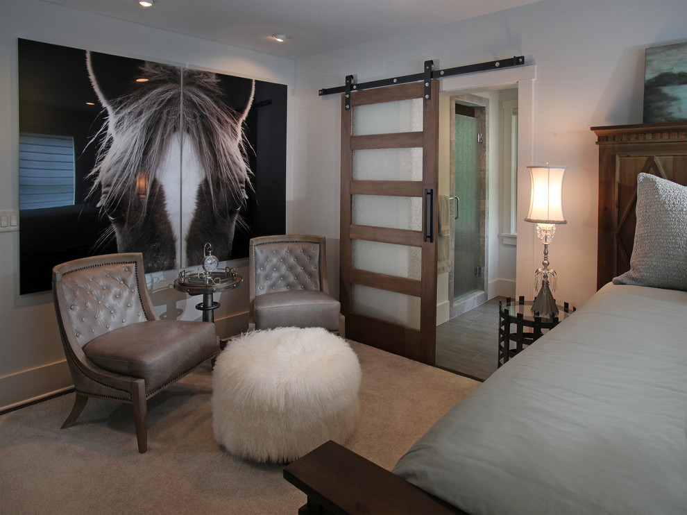 This is an example of a mid-sized country guest bedroom in Atlanta with white walls and carpet.