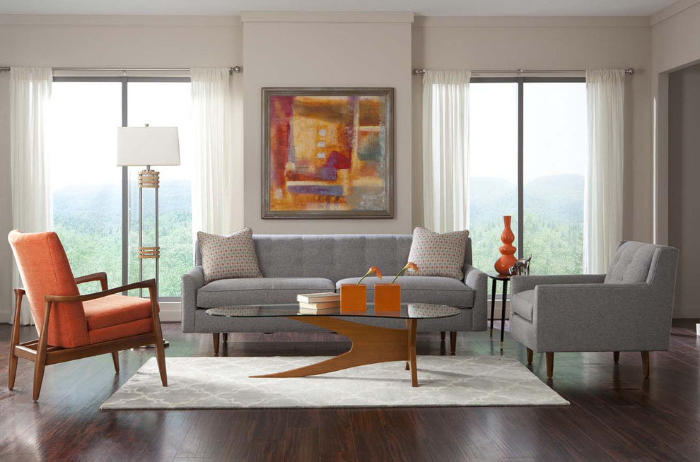 This is an example of a mid-sized midcentury formal open concept living room in Houston with beige walls, dark hardwood floors, no fireplace, no tv and brown floor.