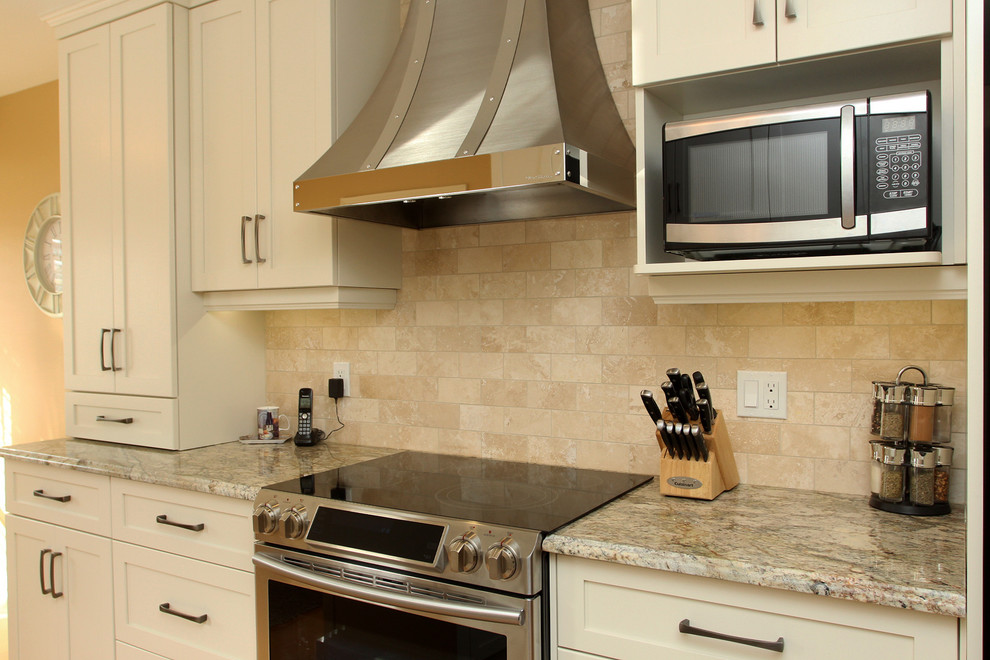 Small transitional galley enclosed kitchen photo with white cabinets, granite countertops, beige backsplash, stainless steel appliances, no island and shaker cabinets