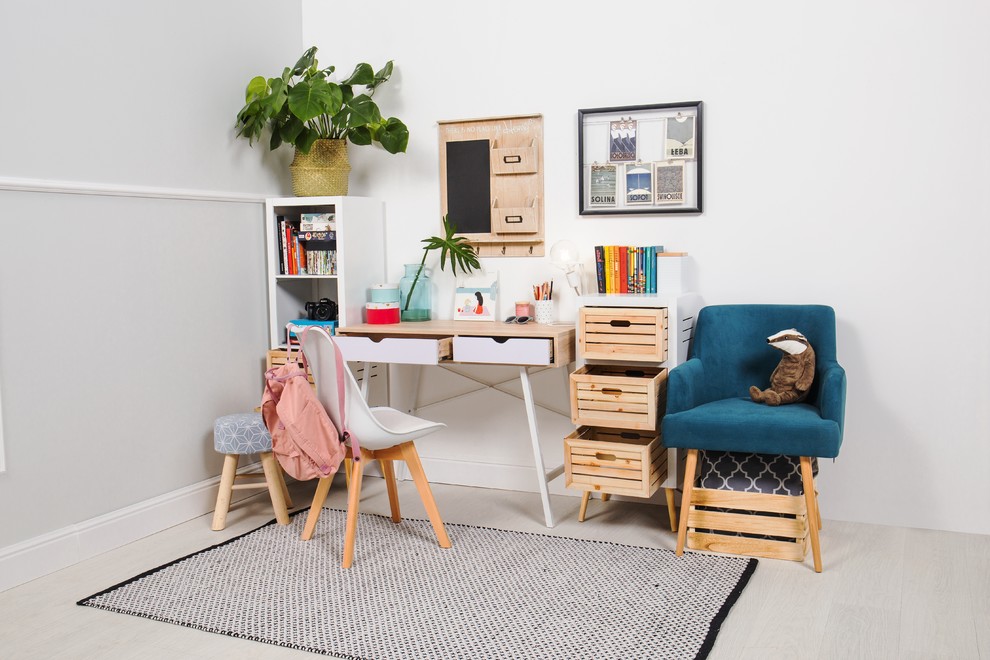Design ideas for a small scandinavian kids' study room for kids 4-10 years old and girls with white walls, light hardwood floors and grey floor.