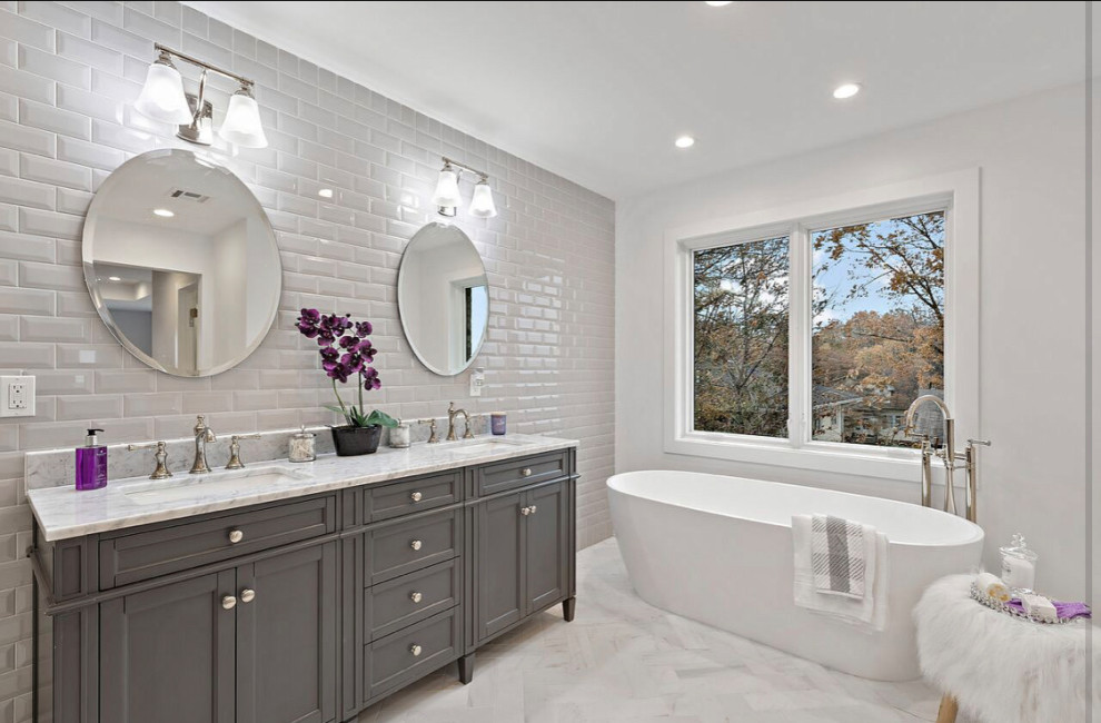 Mid-sized transitional master white tile and subway tile marble floor bathroom photo with shaker cabinets, white cabinets, marble countertops and white countertops