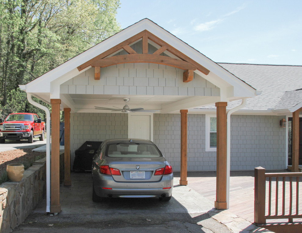 Photo of a small beach style one-car carport in Charlotte.