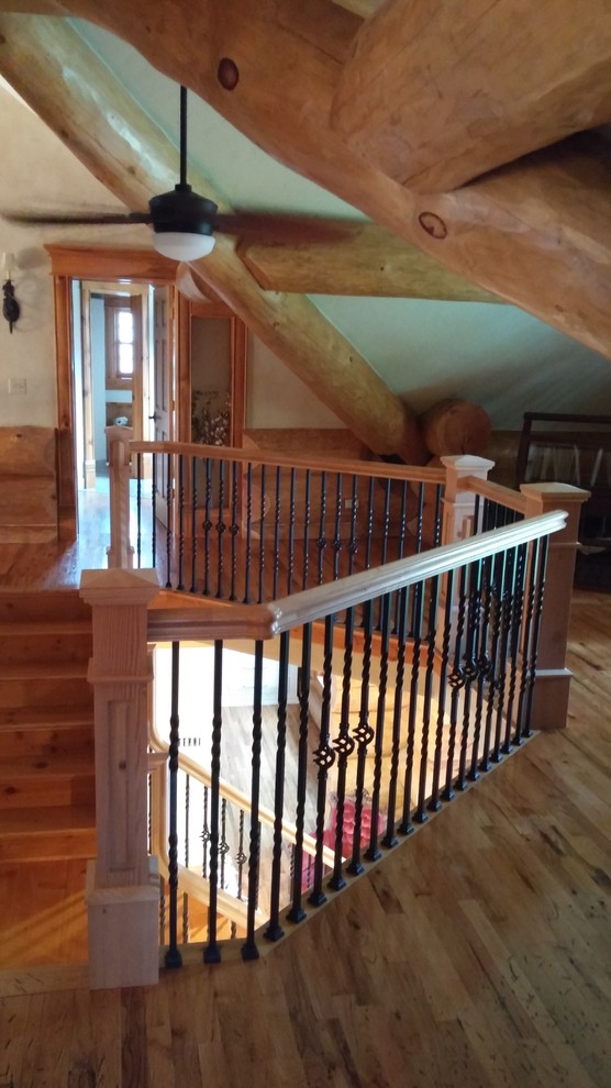 Example of a large mountain style wooden u-shaped staircase design with wooden risers