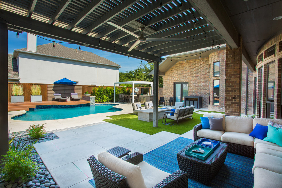 Photo of a large modern custom-shaped pool in Dallas with concrete slab.