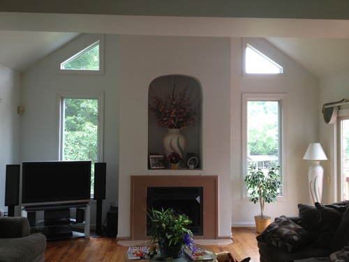 Should I hang TV over fireplace