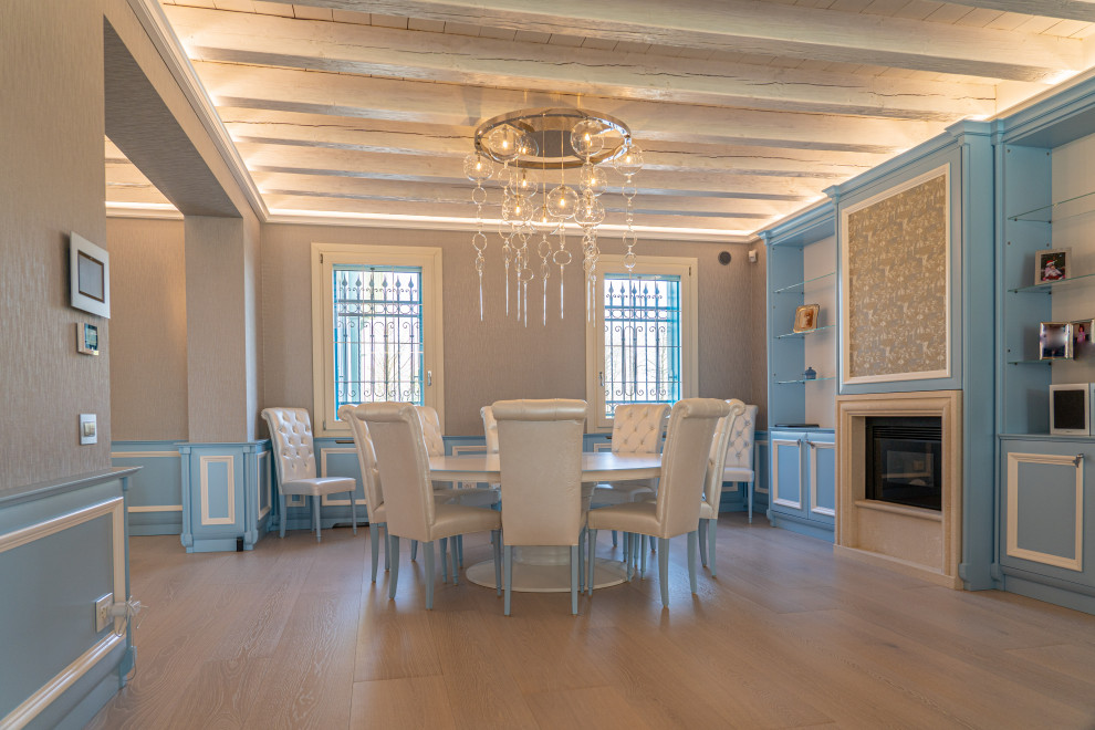 This is an example of a contemporary dining room in Other with exposed beams and wainscoting.
