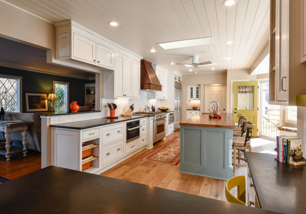 Inspiration for a large transitional l-shaped kitchen in DC Metro with a farmhouse sink, recessed-panel cabinets, marble benchtops, stainless steel appliances and with island.