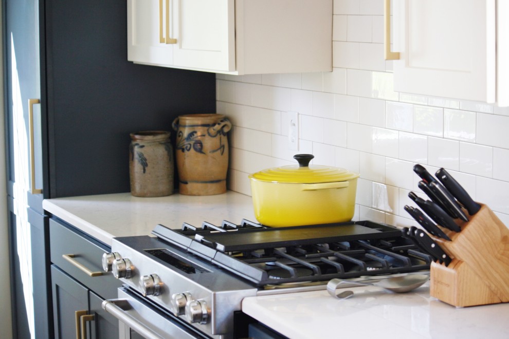 Inspiration for a transitional gray floor kitchen remodel with a farmhouse sink, quartz countertops and stainless steel appliances