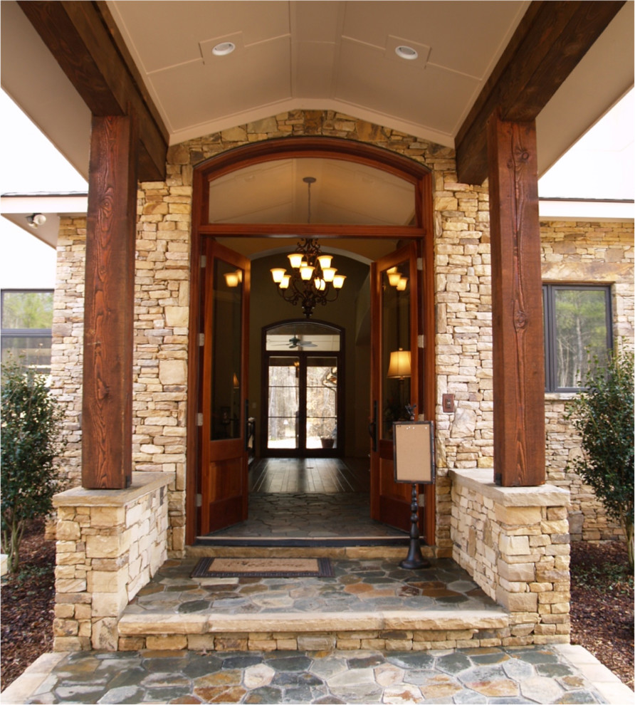 Transitional front door photo with a medium wood front door