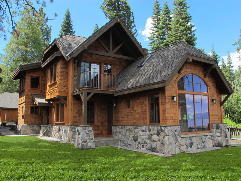 Design ideas for a large country two-storey brown exterior in Sacramento with wood siding and a clipped gable roof.