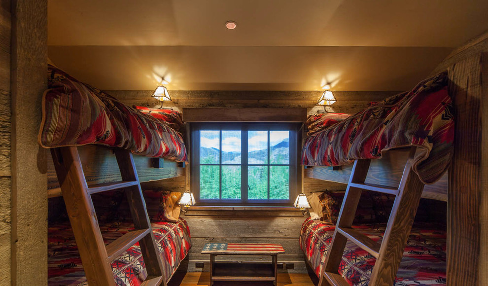 Huge mountain style master carpeted bedroom photo with beige walls