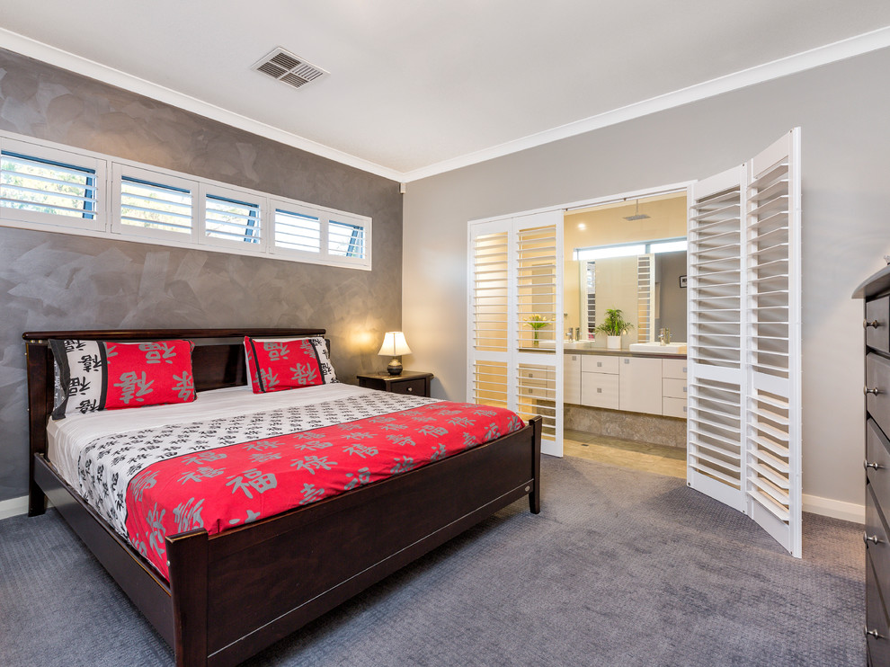 This is an example of an asian master bedroom in Perth with grey walls, carpet and grey floor.