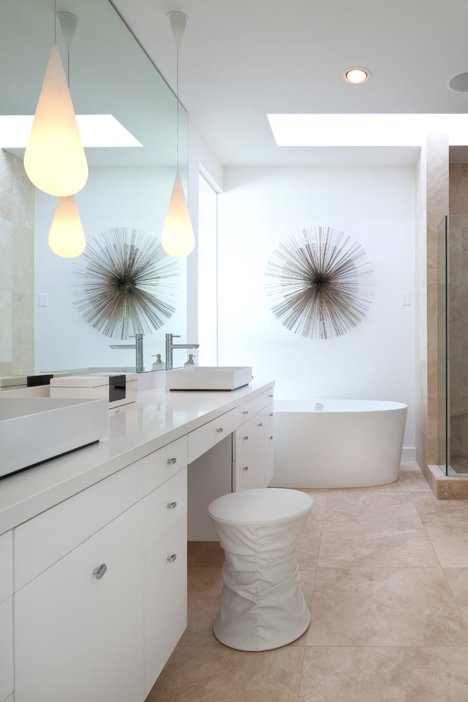 Inspiration for a contemporary bathroom in Vancouver with a freestanding tub and a vessel sink.