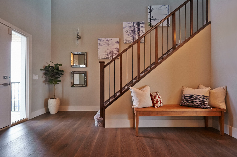 Single front door - transitional medium tone wood floor single front door idea in Calgary with beige walls and a white front door
