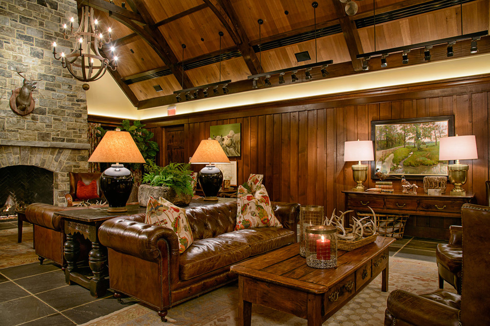 Example of a mountain style formal and enclosed living room design in DC Metro with a standard fireplace and a stone fireplace